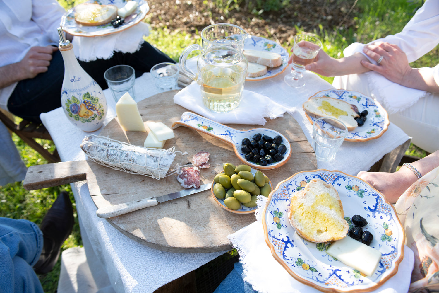 table olives aperitivo appetizers plates ceramics artisan countryside olive grove